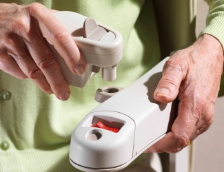 A woman buckles herself into a stairlift